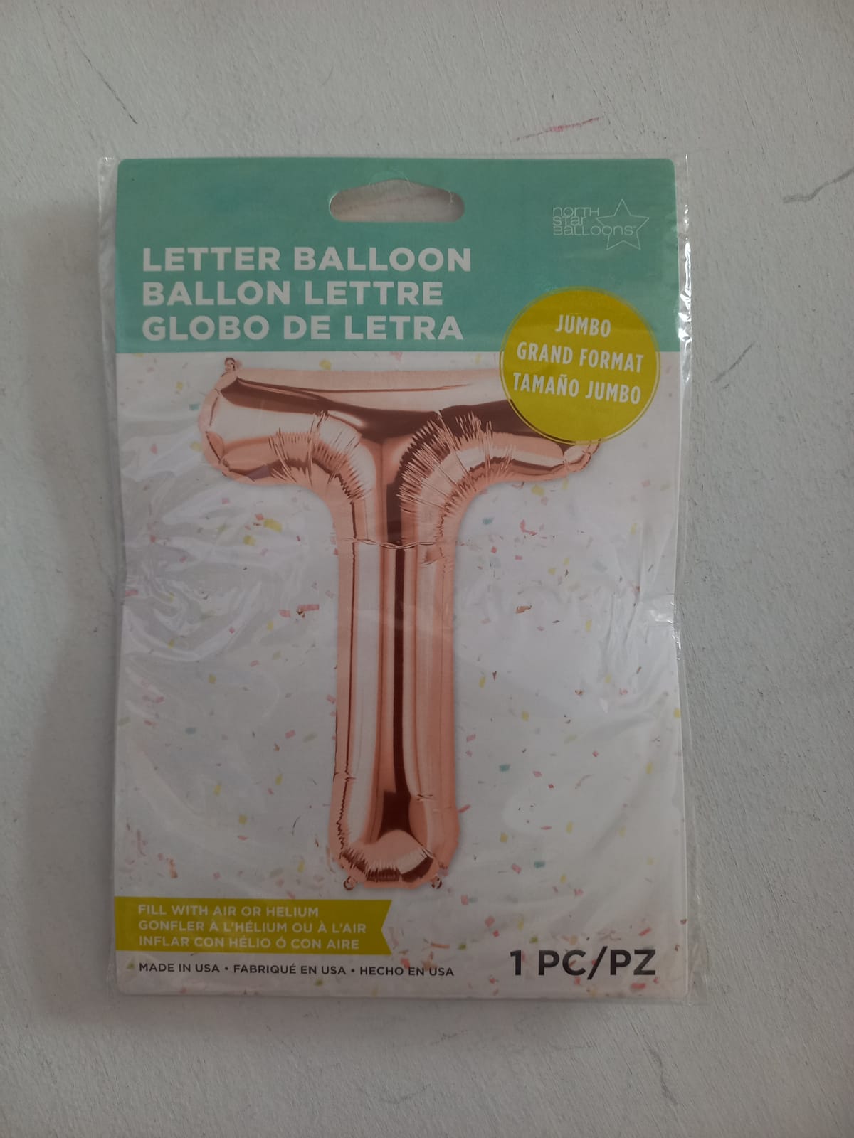 letra T rosa oro